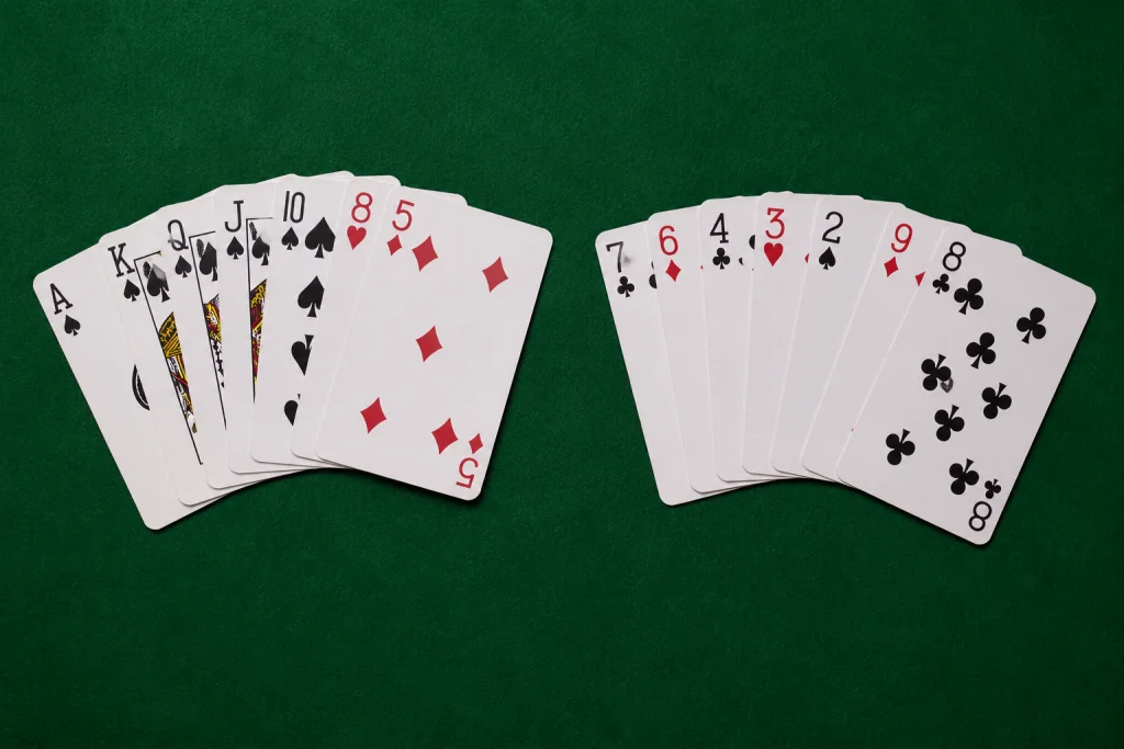 A spade-heavy strong hand beside a weak, low-card hand for comparison